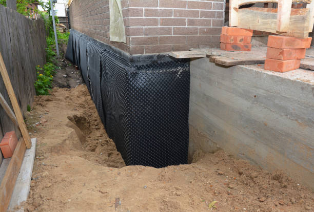 Happy homeowners after waterproofing job in Maple Rapids